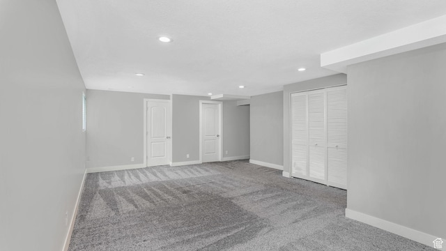 finished basement featuring recessed lighting, carpet floors, and baseboards
