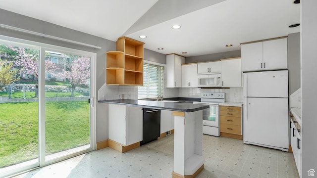 kitchen with light floors, tasteful backsplash, and white appliances