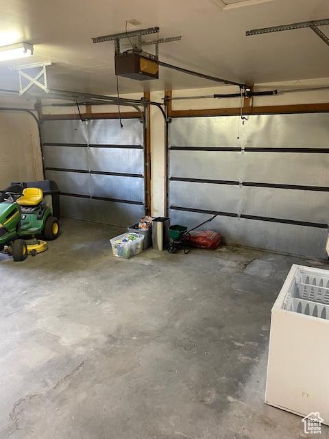 1952 W 8600 N, Neola, UT 84053 - garage featuring a garage door opener