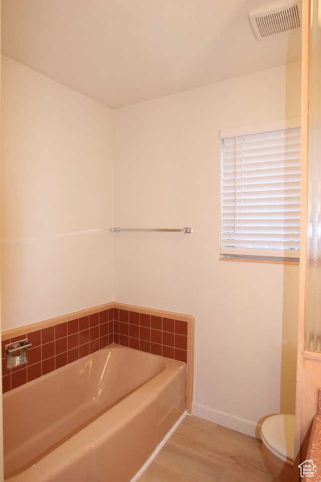 1974 W 5200 S, Roy, UT 84067 - full bathroom with a bath, wood finished floors, toilet, and baseboards