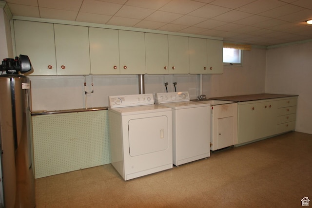 1974 W 5200 S, Roy, UT 84067 - clothes washing area with washer and clothes dryer, cabinet space, and light flooring