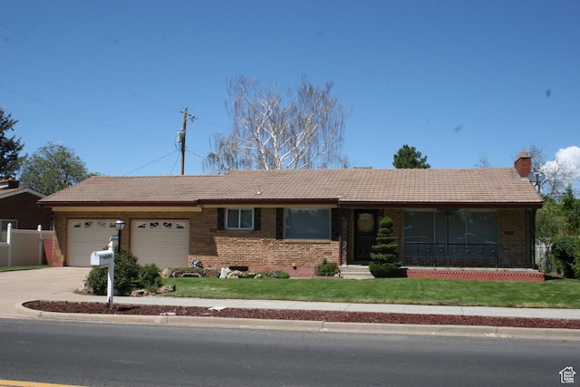 1974 W 5200 S, Roy, UT 84067 - single story home featuring a tile roof, a garage, driveway, and brick siding