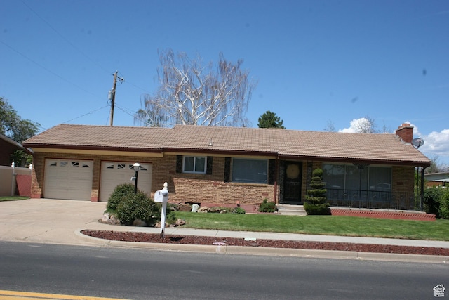 1974 W 5200 S, Roy, UT 84067 - ranch-style home featuring a tiled roof, a garage, brick siding, and a front yard