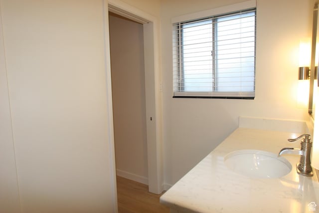 1974 W 5200 S, Roy, UT 84067 - bathroom with vanity, wood finished floors, and baseboards