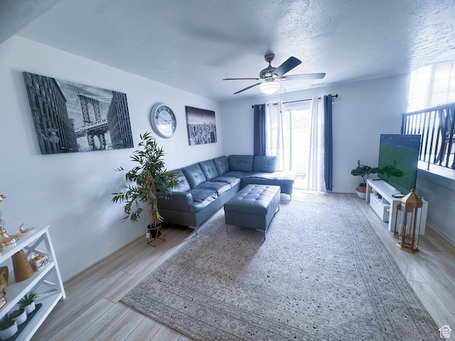 1689 W Crystal Ridge Dr S, West Jordan, UT 84084 - living room with baseboards, wood finished floors, a textured ceiling, and ceiling fan