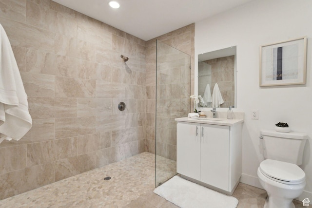 bathroom featuring toilet, walk in shower, vanity, tile patterned flooring, and recessed lighting