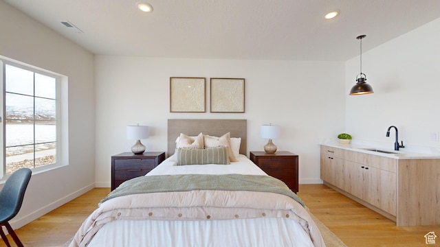 1822 S 930 E Unit 541, Heber City, UT 84032 - bedroom with multiple windows, a sink, light wood finished floors, and recessed lighting
