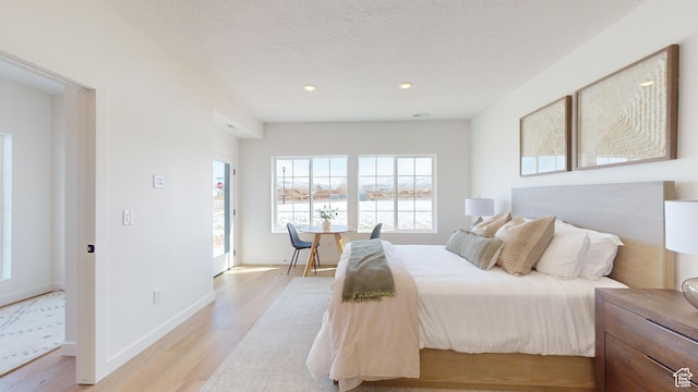 1822 S 930 E Unit 541, Heber City, UT 84032 - bedroom featuring recessed lighting, light wood-style floors, a water view, and baseboards