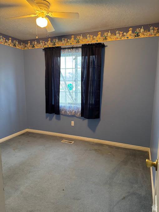 1006 S 1040 W, Payson, UT 84651 - carpeted spare room featuring baseboards, a ceiling fan, and a textured ceiling