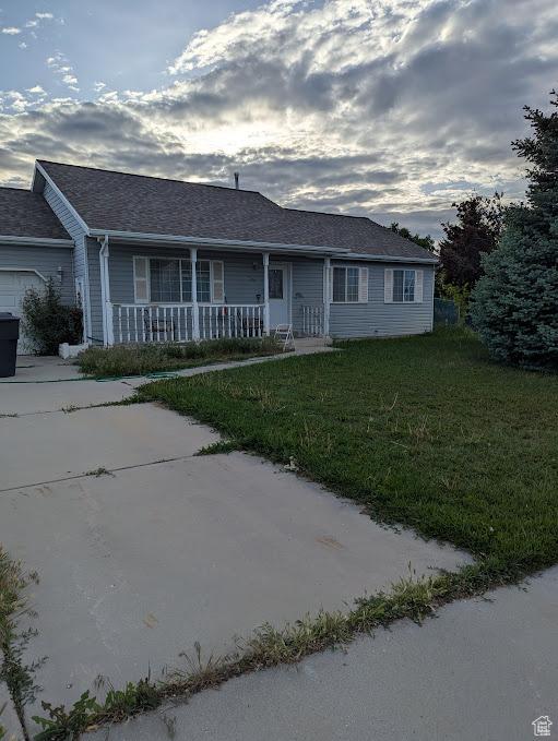 1006 S 1040 W, Payson, UT 84651 - ranch-style home featuring a porch, a front yard, and concrete driveway