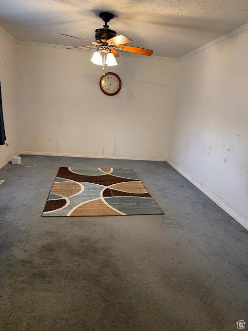 1006 S 1040 W, Payson, UT 84651 - empty room with dark colored carpet, a ceiling fan, baseboards, ornamental molding, and a textured ceiling