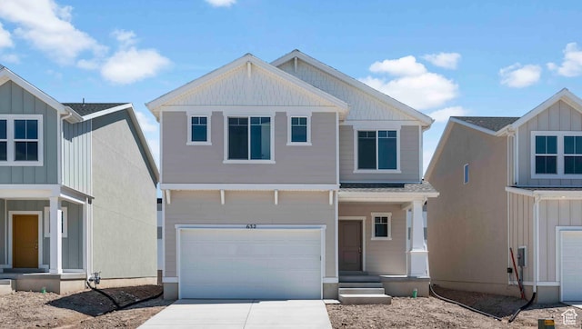 view of front of property featuring a garage, driveway, and board and batten siding