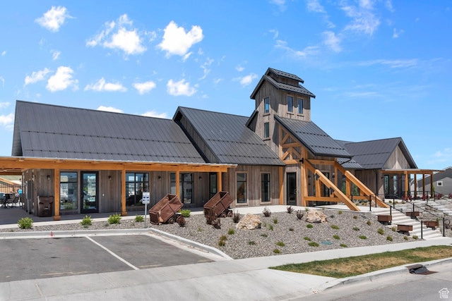 view of building exterior featuring uncovered parking