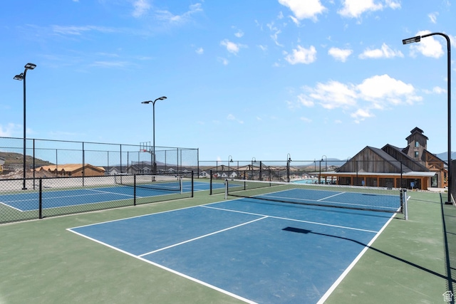view of sport court with fence