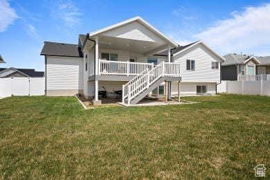 1065 W 275 S, Tremonton, UT 84337 - rear view of property featuring a lawn, a fenced backyard, and stairway