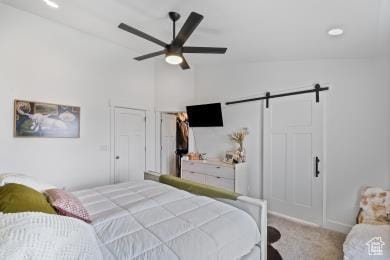1065 W 275 S, Tremonton, UT 84337 - bedroom featuring a barn door, baseboards, lofted ceiling, a ceiling fan, and carpet floors