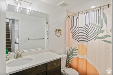 1065 W 275 S, Tremonton, UT 84337 - full bathroom with toilet, vanity, a shower with shower curtain, and visible vents