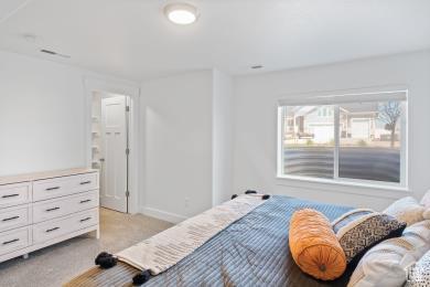 1065 W 275 S, Tremonton, UT 84337 - bedroom featuring baseboards and light colored carpet