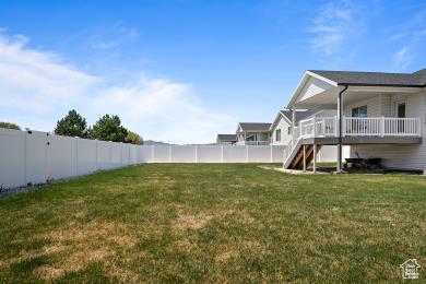1065 W 275 S, Tremonton, UT 84337 - view of yard featuring a fenced backyard and stairway