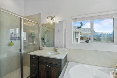 1065 W 275 S, Tremonton, UT 84337 - bathroom featuring a bath, vanity, and a stall shower