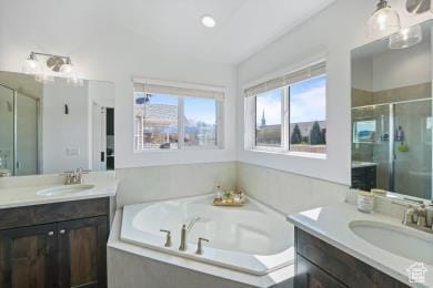 1065 W 275 S, Tremonton, UT 84337 - full bath with a garden tub, two vanities, a sink, and a stall shower