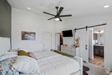 1065 W 275 S, Tremonton, UT 84337 - bedroom featuring a barn door, a ceiling fan, wood finished floors, lofted ceiling, and recessed lighting