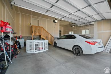1065 W 275 S, Tremonton, UT 84337 - garage featuring a garage door opener
