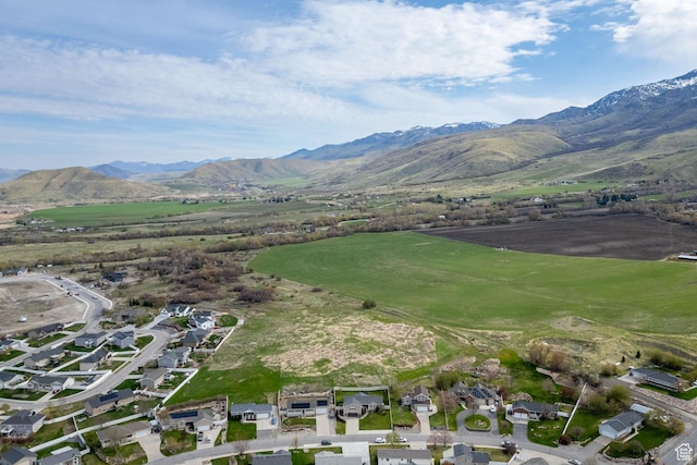 drone / aerial view with a residential view and a mountain view