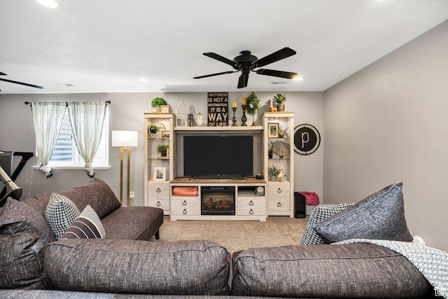 living area with visible vents, a ceiling fan, carpet flooring, and recessed lighting