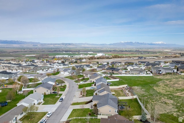 birds eye view of property with a mountain view and a residential view