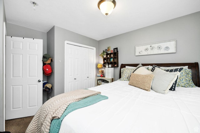 carpeted bedroom with a closet