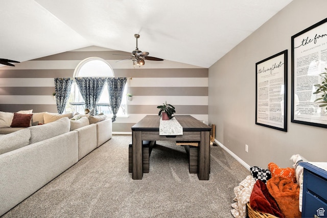 dining space featuring lofted ceiling, baseboards, a ceiling fan, and carpet flooring