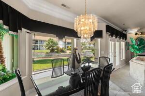 150 S Crystal Lakes Dr Unit 51, St George, UT 84770 - dining space with visible vents and a notable chandelier