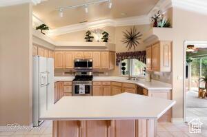 150 S Crystal Lakes Dr Unit 51, St George, UT 84770 - kitchen featuring light brown cabinets, rail lighting, appliances with stainless steel finishes, light countertops, and light tile patterned flooring