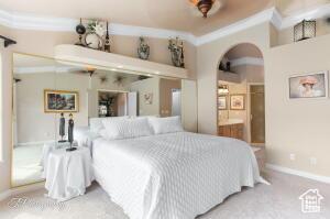150 S Crystal Lakes Dr Unit 51, St George, UT 84770 - bedroom featuring baseboards and arched walkways