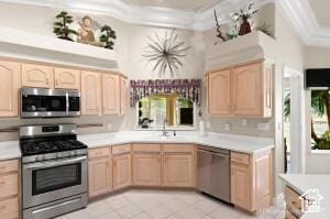 150 S Crystal Lakes Dr Unit 51, St George, UT 84770 - kitchen with a sink, stainless steel appliances, light brown cabinets, light tile patterned flooring, and light countertops