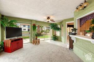 150 S Crystal Lakes Dr Unit 51, St George, UT 84770 - carpeted living room with a ceiling fan