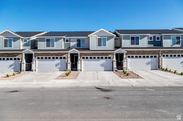 3814 S Landmark Ln Unit 1395, Magna, UT 84044 - multi unit property featuring stone siding, driveway, and a garage