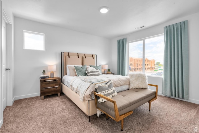 3814 S Landmark Ln Unit 1395, Magna, UT 84044 - carpeted bedroom with baseboards, multiple windows, and visible vents