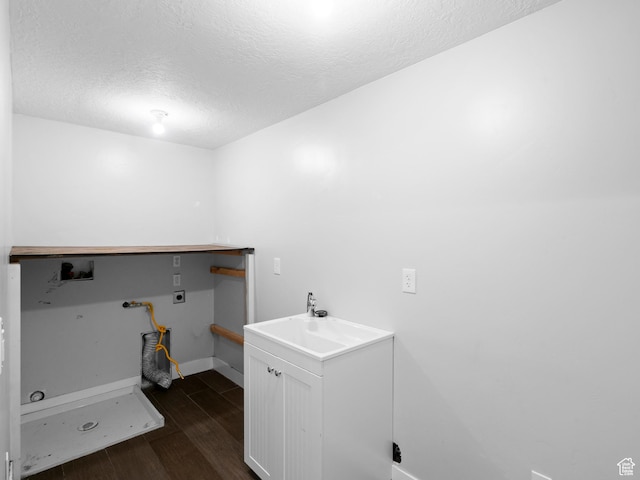361 W Bridle Cir, Saratoga Springs, UT 84045 - washroom with a textured ceiling, laundry area, washer hookup, electric dryer hookup, and dark wood-type flooring