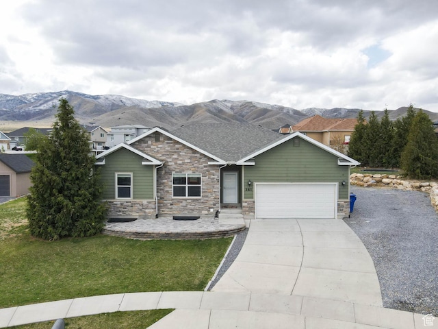 361 W Bridle Cir, Saratoga Springs, UT 84045 - view of front facade featuring concrete driveway, a front lawn, stone siding, a mountain view, and a garage