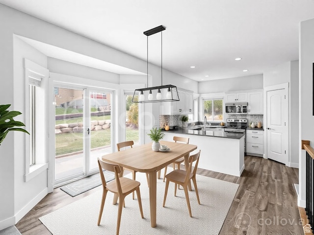 361 W Bridle Cir, Saratoga Springs, UT 84045 - dining space with baseboards, dark wood-style floors, and recessed lighting