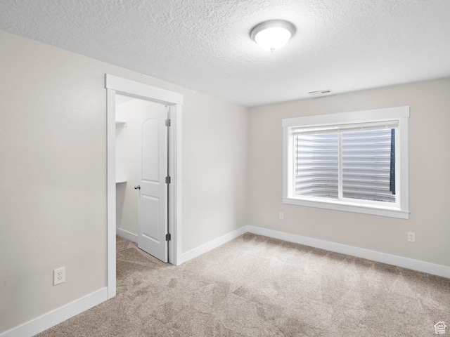361 W Bridle Cir, Saratoga Springs, UT 84045 - spare room with baseboards, carpet flooring, a textured ceiling, and visible vents