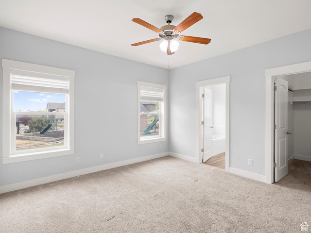 361 W Bridle Cir, Saratoga Springs, UT 84045 - unfurnished bedroom with carpet, baseboards, a spacious closet, and multiple windows