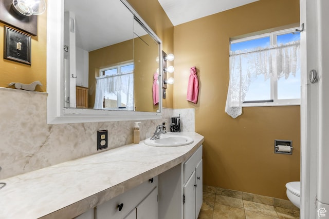 484 W 200 S, Tooele, UT 84074 - bathroom with backsplash, a wealth of natural light, toilet, and vanity