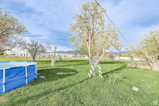 484 W 200 S, Tooele, UT 84074 - view of yard featuring an outdoor pool and a mountain view