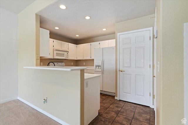 974 W Big River Ct Unit 2, South Salt Lake, UT 84119 - kitchen with white cabinets, white appliances, light countertops, recessed lighting, and a peninsula