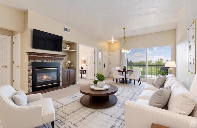 974 W Big River Ct Unit 2, South Salt Lake, UT 84119 - living room featuring carpet flooring, visible vents, a wealth of natural light, and a fireplace
