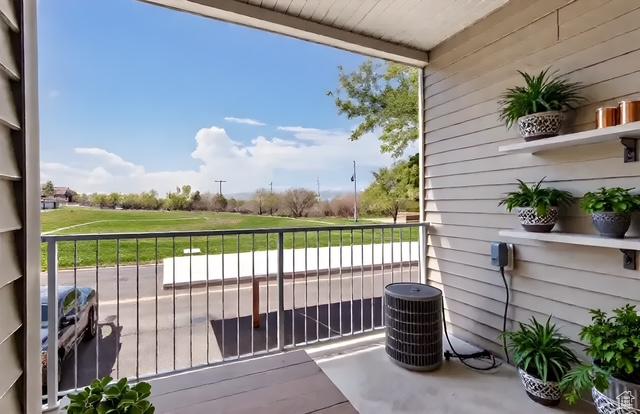974 W Big River Ct Unit 2, South Salt Lake, UT 84119 - balcony with view of golf course and central AC unit