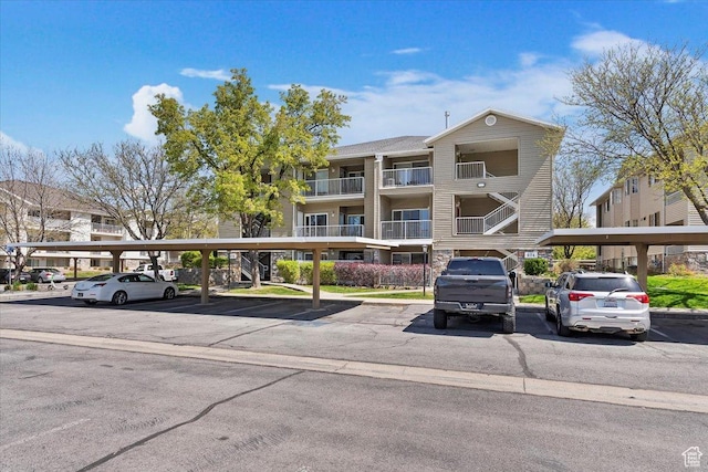 974 W Big River Ct Unit 2, South Salt Lake, UT 84119 - view of building exterior featuring covered parking
